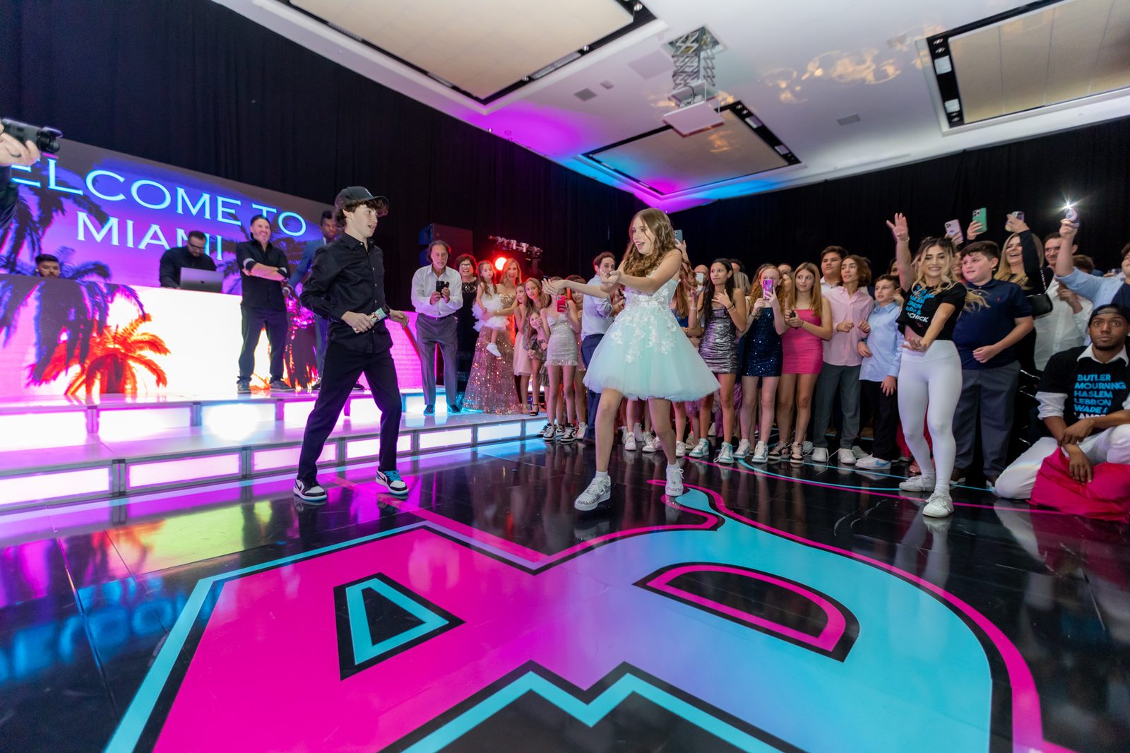 Guests dancing on a custom LED dance floor at a Miami bar mitzvah party