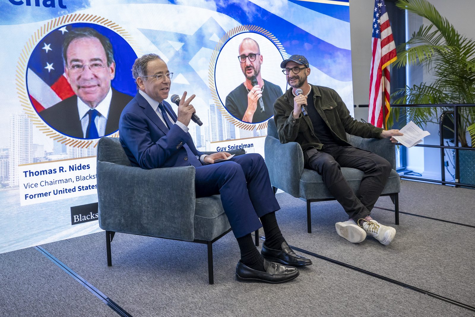 Fireside chat on stage at a corporate conference