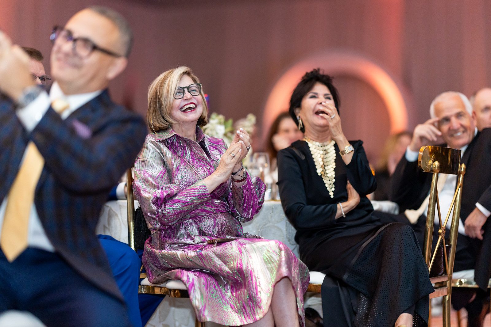 Guests applauding at a corporate gala