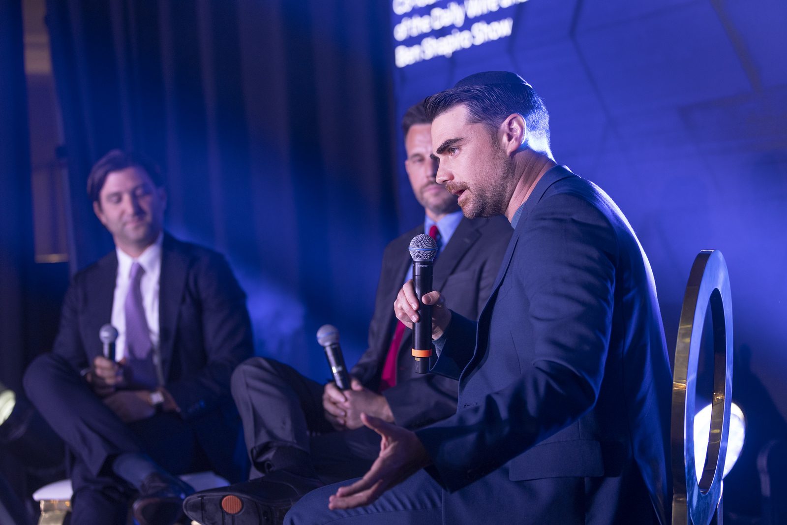 Panel discussion under stage lighting
